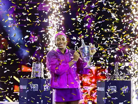 US' Coco Gauff celebrates with her winning trophy after defeating China's Zheng Qinwen in their women's singles final tennis match at the WTA Finals Championship in Riyadh on Saturday.