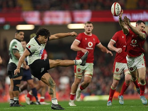 Fiji's fly-half Caleb Muntz has his kick charged down during the Autumn Nations Series International rugby union test match against Wales at the Principality Stadium, in Cardiff on Sunday.