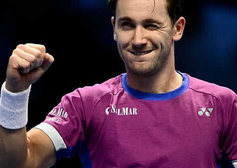 Norway's Casper Ruud celebrates after winning the match against Spain's Carlos Alcaraz  at the ATP Finals tennis tournament in Turin on Monday.
