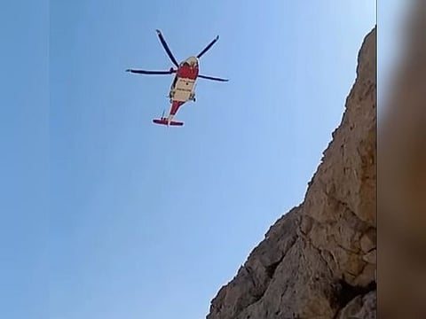 The climber was located and airlifted to Al Qasimi Hospital for treatment.