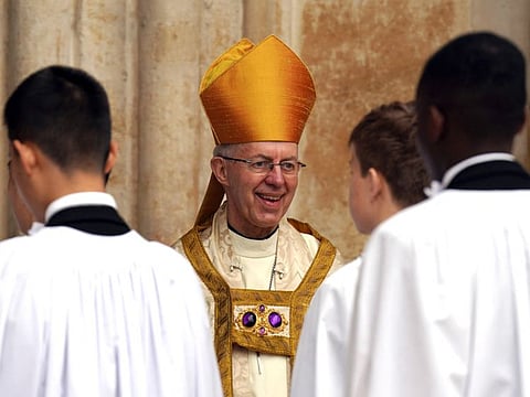 Archbishop of Canterbury Justin Welby smiles at Westminster Abbey in central London on May 6, 2023, ahead of the coronations of Britain's King Charles III and Britain's Camilla, Queen Consort.  