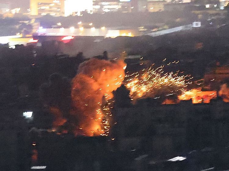 A ball of fire rises from the site of an Israeli airstrike that targeted a neighbourhood in Beirut's southern suburbs on November 13, 2024. 