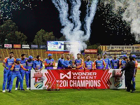 India players hold the trophy as they celebrate winning the T20 series following the fourth T20 international match against South Africa at Wanderers stadium in Johannesburg on November 15, 2024. 