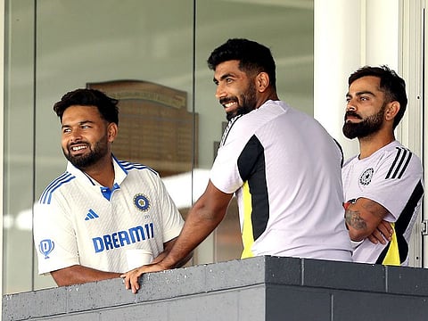 Indian players Virat Kohli (R), Rishabah Pant (L) and Jasprit Bumrah look on during the internal practice match between India and India A cricket teams at the WACA in Perth on November 15, 2024.   