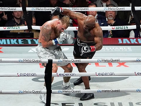 US retired pro-boxer Mike Tyson (R) and US YouTuber/boxer Jake Paul (L) fight during the heavyweight boxing bout at The Pavilion at AT&T Stadium in Arlington, Texas, November 15, 2024. 