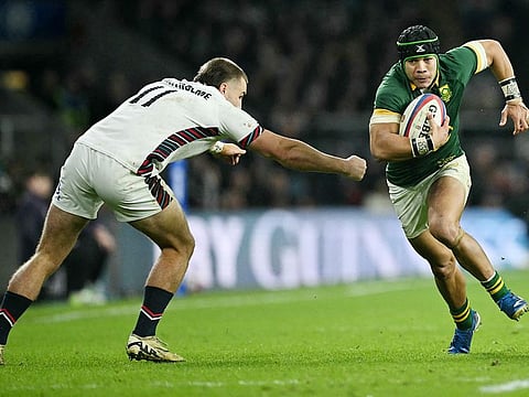 South Africa's wing Cheslin Kolbe (R) beats England's Ollie Sleightholme to score during the Autumn Nations Series International Rugby Union match at Allianz Stadium, Twickenham in south-west London, on November 16, 2024. 
