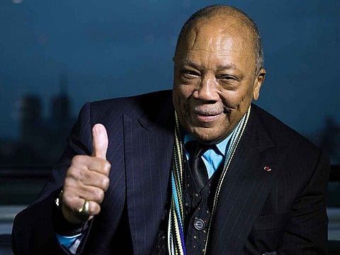 US musician and producer Quincy Jones poses after being awarded Grand Commandeur de l'Ordre des Arts et des Lettres on October 6, 2014 at the Institut du Monde Arabe (Arabic World Institute) in Paris. 