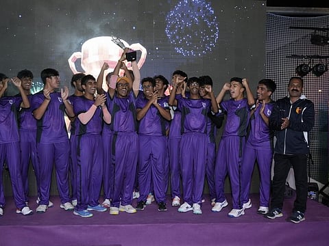 Cambridge High School Abu Dhabi players with the trophy after emerging champions in the DP World ILT20 Schools Cup 2024.