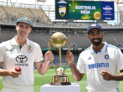 Australias captain Pat Cummins (left) and Indias Jasprit Bumrah with the Border-Gavaskar trophy at Optus Stadium in Perth on Thursday. It will be the fifth time that two fast bowlers are leading their respective teams in Tests.