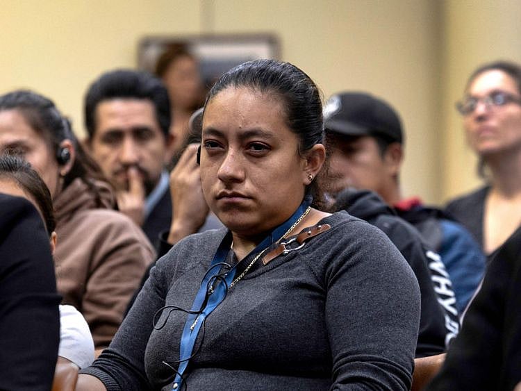 Immigrant families, rights groups and concerned citizens attend a meeting with state and local officials to discuss the uncertain future following President-elect Donald Trump's deportation plan in Stamford, Connecticut.  
