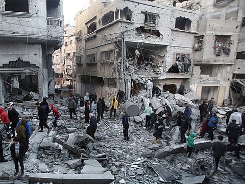 Palestinians inspect the damage at the site of an Israeli airstrike in the Nuseirat camp in central Gaza on November 27, 2024.