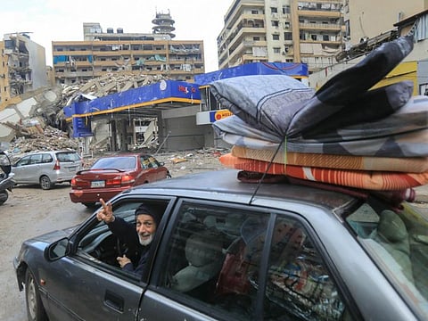 People return with their belongings to their homes in Beiruts southern suburbs on November 27, 2024, after a ceasefire between Israel and Hezbollah took effect.  