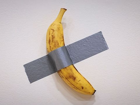 Italian visual artist Maurizio Cattelan's duct-taped Banana entitled "Comedian," is on display during a media preview at Sotheby's in New York, on November 8, 2024. 