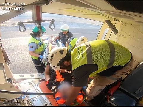 The Air Ambulance crew from the Air Wing Department of the General Directorate of Security Support at the Ministry of Interior airlifting an accident victim in Sharjah