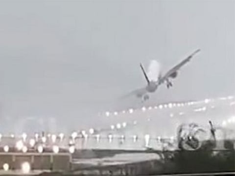  The plane's wings graze just inches above the ground before swiftly ascending back into the air.