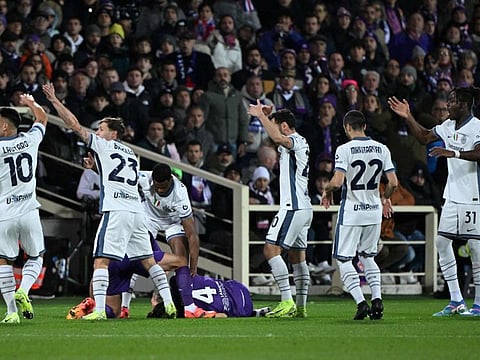 Fiorentina and Inter Milan players call for medics after Italian midfielder Edoardo Bove suddenly collapsed to the ground at the Artemio Franchi stadium in Florence on Sunday.