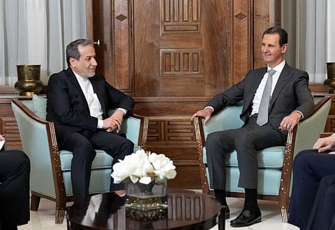Iran's Foreign Minister Abbas Araghchi (left) meeting Syrian President Bashar Al Assad in Damascus on December 1, 2024.  
