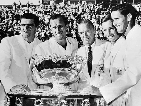 From left: Australian players Bob Mark, Neale Fraser, Harry Hopman (coach), Rod Laver and Roy Emerson pose with the David Cup trophy after winning the final against Italy (5-0) in Sydney on December 21, 1961.
