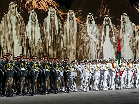 Members of the UAE Armed Force participate in the 53rd Eid Al Etihad official show, at the base of Jebel Hafeet. 
