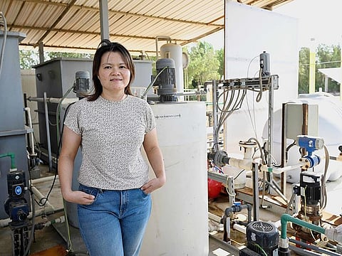 Peiying Hong, an environmental science and engineering academic at the King Abdullah University of Science and Technology (KAUST), poses for a picture at a wastewater treatment plant developed by the university and located in the desert near Jeddah on Saudi's Red Sea coast on November 21, 2024. 