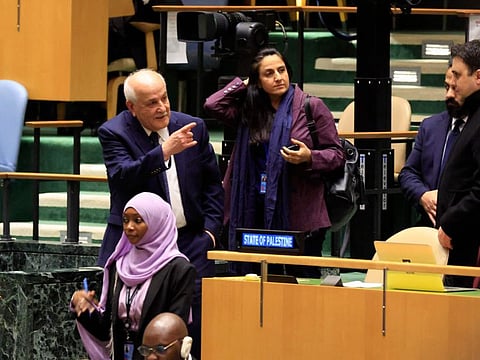 Palestinian UN Representative Riyad Mansour (left) leaves after addressing the General Assembly 46th plenary meeting on the Question of Palestine on December 3, 2024, at UN headquarters in New York.  