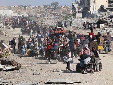 Palestinians, displaced from Beit Lahia, arrive in Jabalia in the northern Gaza Strip on December 4, 2024, amid the ongoing war between Israel and the Hamas militants. 