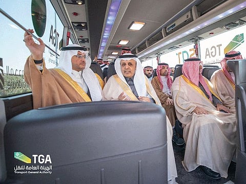 Saudi officials board hydrogen-powered bus during its launch. 