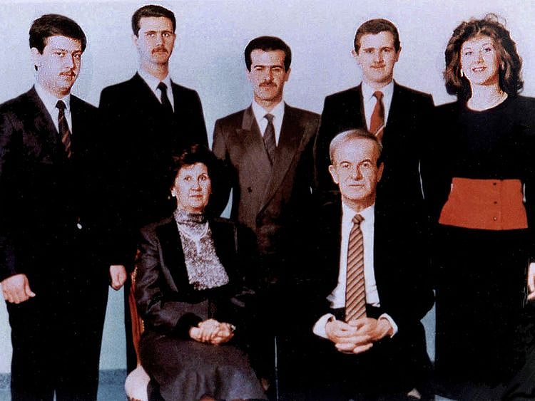 A family picture dated 1985 shows Syria's late president Hafez Al Assad and his wife Anissah Makhlouf (seated) and, behind them, from right their five children: Bushra, the late Majd, the late Bassel (1962-94), deposed president Bashar, and the youngest son, Maher.   