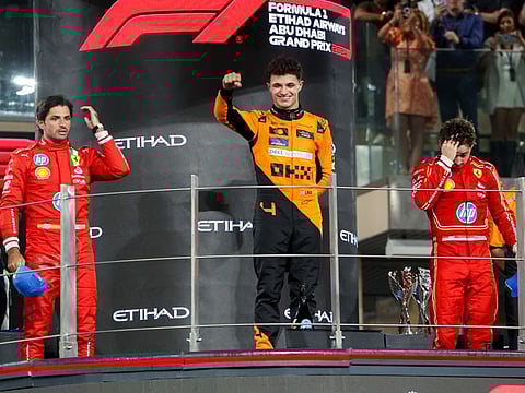 Lando Norris of McLaren with Carlos Sainz and Charles Leclerc of Ferrari on the podium of the Formula 1 Etihad Airways Abu Dhabi Grand Prix 2024 at Yas Marina Circuit on Sunday. 