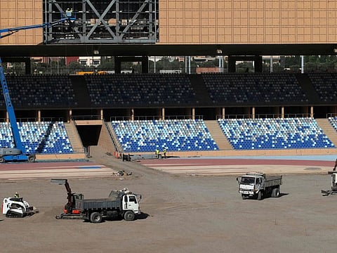 Construction workers are seen at work at the Marrakesh Stadium in the Moroccan capital on December 5.