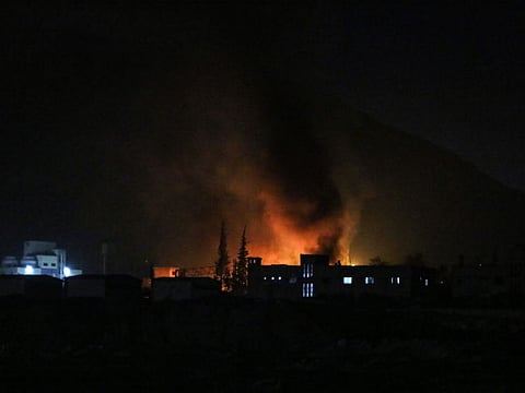 Smoke billows on the outskirts of the Syrian capital Damascus following Israeli airstrikes on December 9, 2024.  