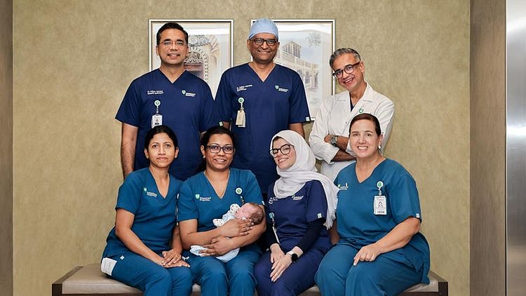 Dr Omendra Narayan, Consultant Paediatric Pulmonologist; Dr Sridhar Ramaiah, Consultant Neonatal Intensivist; Dr Osama Hamud, Consultant Neonatal Intensivist; and Dr Chetan Gupta, Consultant Paediatric Intensivist, with the patient and the team behind the surgery