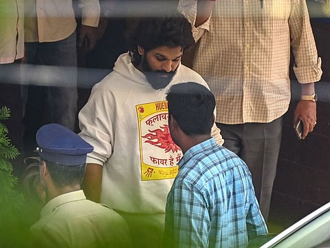 Indian actor Allu Arjun (C) comes out of the Chikkadpally police station following his arrest by the police in Hyderabad on December 13, 2024. 