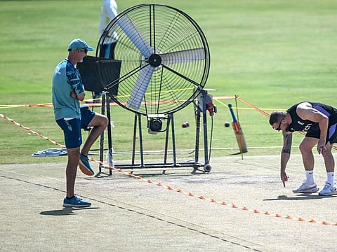 England's head coach Brendon McCullum (right) with his Pakistani counterpart Jason Gillespie inspects the pitch during a practice session ahead of their second Test at the Multan Cricket Stadium in Multan on October 13.