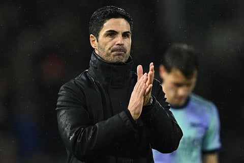 Arsenal's Spanish manager Mikel Arteta applauds fans after the English Premier League football match against Fulham at Craven Cottage in London on December 8.