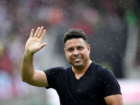 Brazilian former football star Ronaldo waves to the crowd during a friendly match with legends of Brazil's Flamengo and Italy's Inter Milan as farewell of former brazilian player Adriano at Maracana Stadium in Rio de Janeiro on December 15.