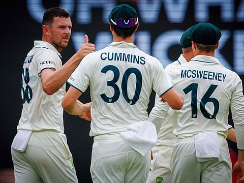 Australia's Josh Hazlewood celebrates the wicket of India's Virat Kohli on day three of the third Test match at The Gabba in Brisbane on Monday.