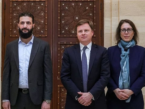 From left: Ahmed Al Sharaa (formerly known as Abu Mohammed Al Jolani), head of the Islamist group Hayat Tahrir Al Sham (HTS) with Stephen Hickey (centre), the director of the Middle East and North Africa department at Britain's Foreign, Commonwealth, and Development Office in Damascus.  