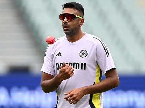 India's Ravichandran Ashwin prepares to bowl during a warm-up session on day one of the second cricket Test match against Australia in Adelaide on December 6.