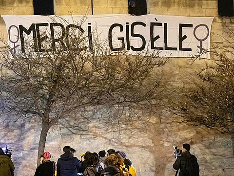 This photograph shows a banner reading "Thanks Gisele" installed by the Avignon feminist association Amazones84 in front of the Avignon courthouse, where the Mazan rape trial takes place, in Avignon, southern France on December 18, 2024.  
