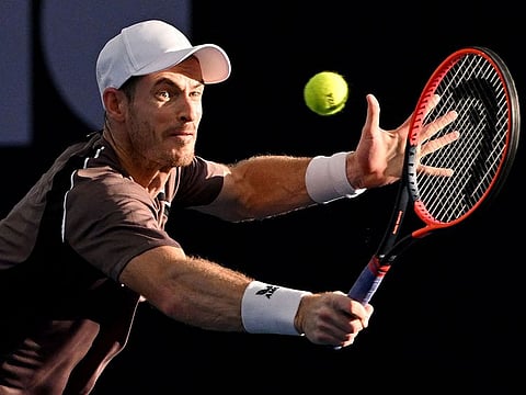 Britain's Andy Murray hits a return during his men's doubles match with partner Holger Rune of Denmark against Russian duo Aslan Karatsev and Roman Safiullin at the Brisbane International tennis tournament in Brisbane on December 31, 2023. 