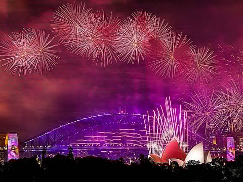Fireworks explode over the Sydney Harbour Bridge and Sydney Opera House during New Year’s Eve celebrations in Sydney on January 1, 2024.