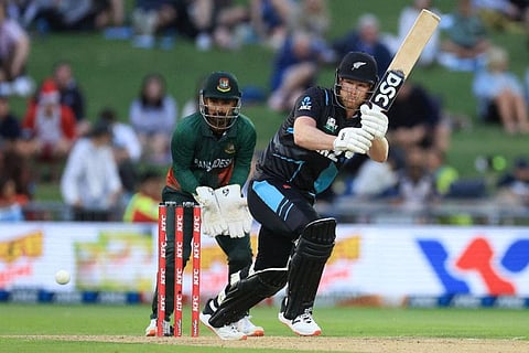 New Zealand's James Neesham (right) in action as Bangladesh's wicketkeeper Litton Das looks on. Neesham's crucial partnership with Santner helped the visitors win the match.