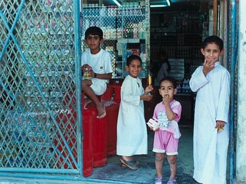 Children at a grocery store in Hatta, Dubai, in 1994. 