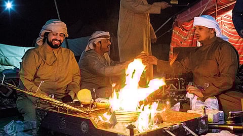 Nayef Al Mesaabi, right, takes over entertaining friends and family while his brother Ahmad does his military service 