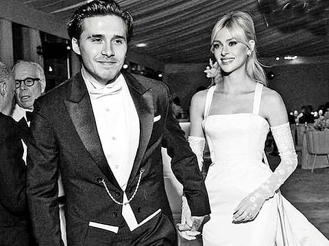 While Nicola wore a Valentino gown, Brooklyn a bespoke suit by Kim Jones of Dior 