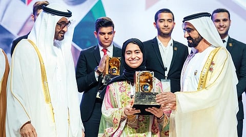 Shaikh Mohamed Bin Zayed Al Nahyan and Shaikh Mohammed Bin Rashid Al Maktoum, presenting the young inventor award to Fatima 