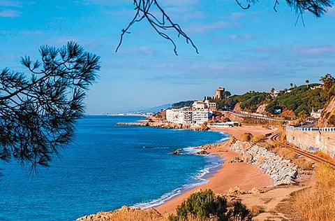 The railway winds around the coast’s small towns and villages, such as sleepy Sant Pol de Mar. 