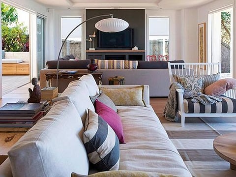 The sofas in the living room are upholstered in outdoor fabric 