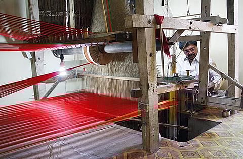 The saris take shape on these looms in Paithan, a little-known town in Maharashtra, India. 